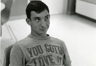 An unidentified Hamline student from 1967 wearing a T-shirt that says "YOU GOTTA LOVE IT"