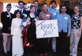a color photo of Hamline international students holding a THANK YOU! sign from the archives