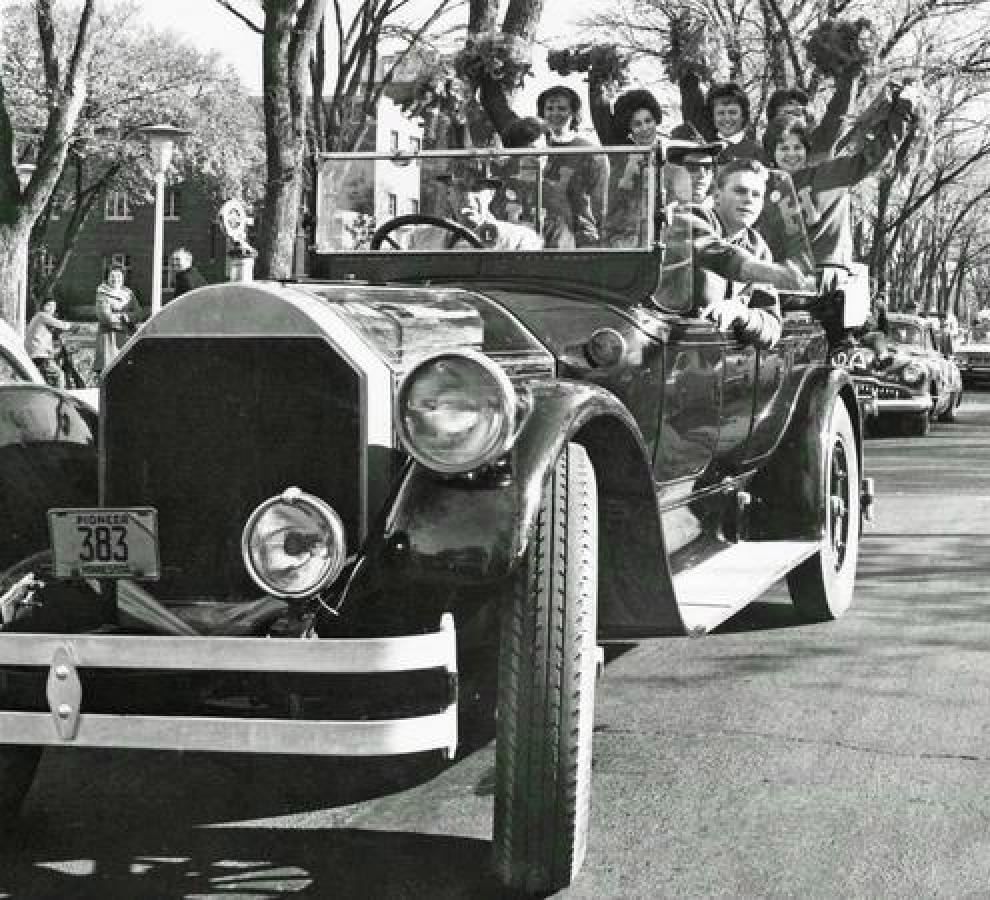 historic photo of students in car