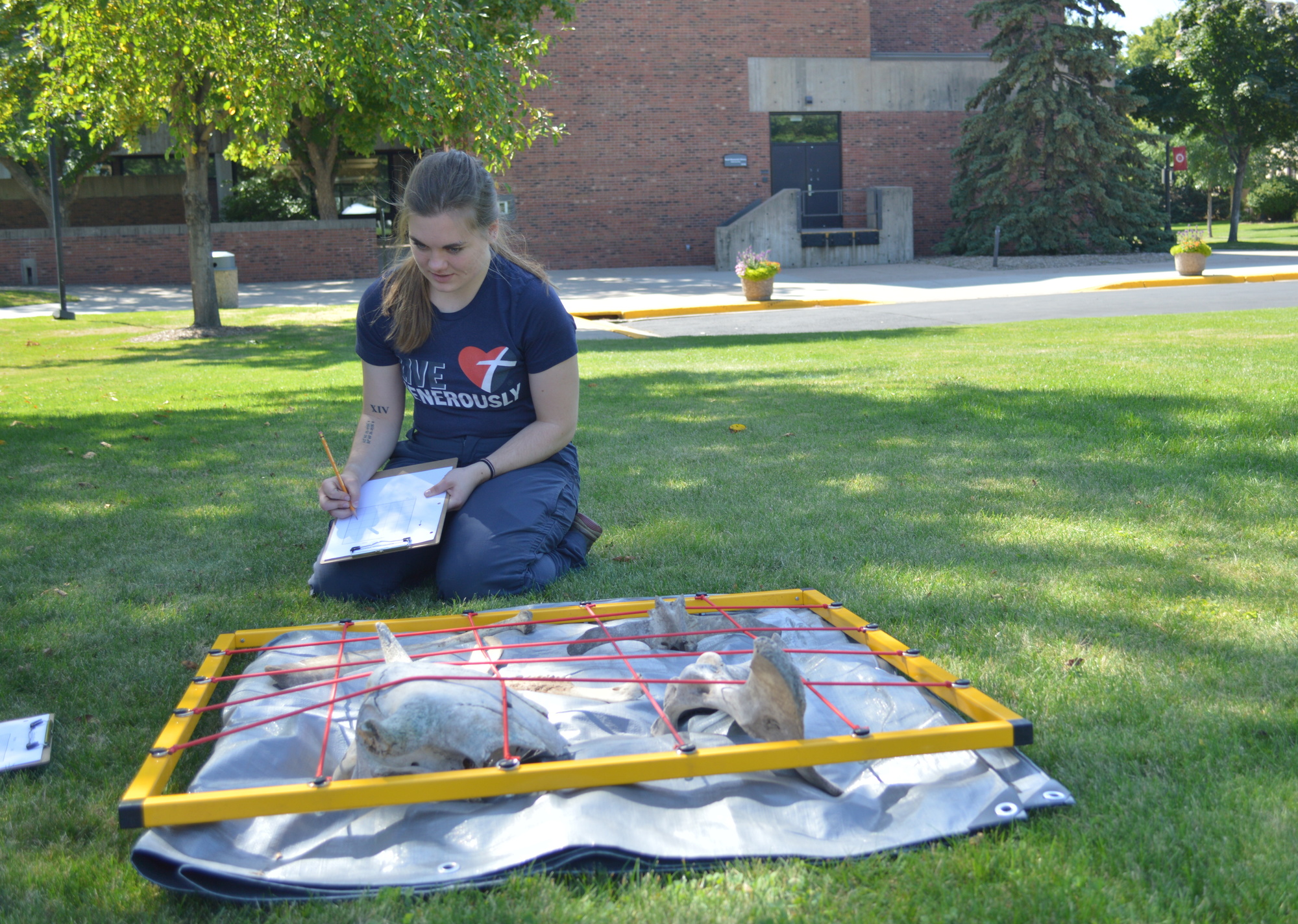 Anthropology, student with artifacts collected from Hamline dig