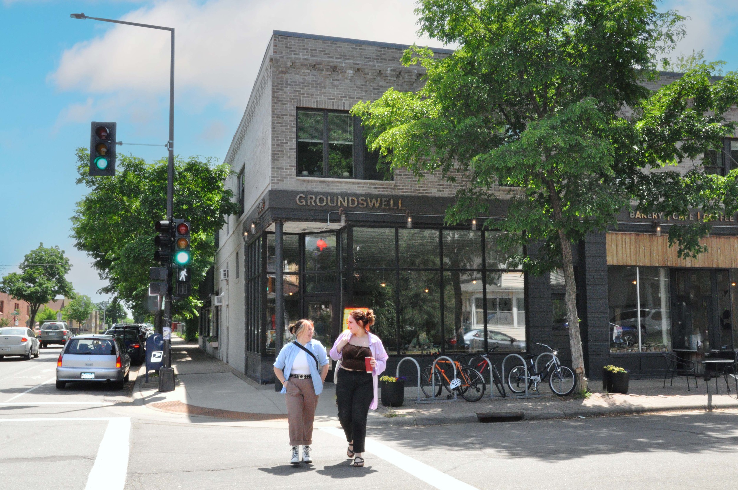 Hamline students in front of Groundswell Coffee in Hamline-Midway neighborhood
