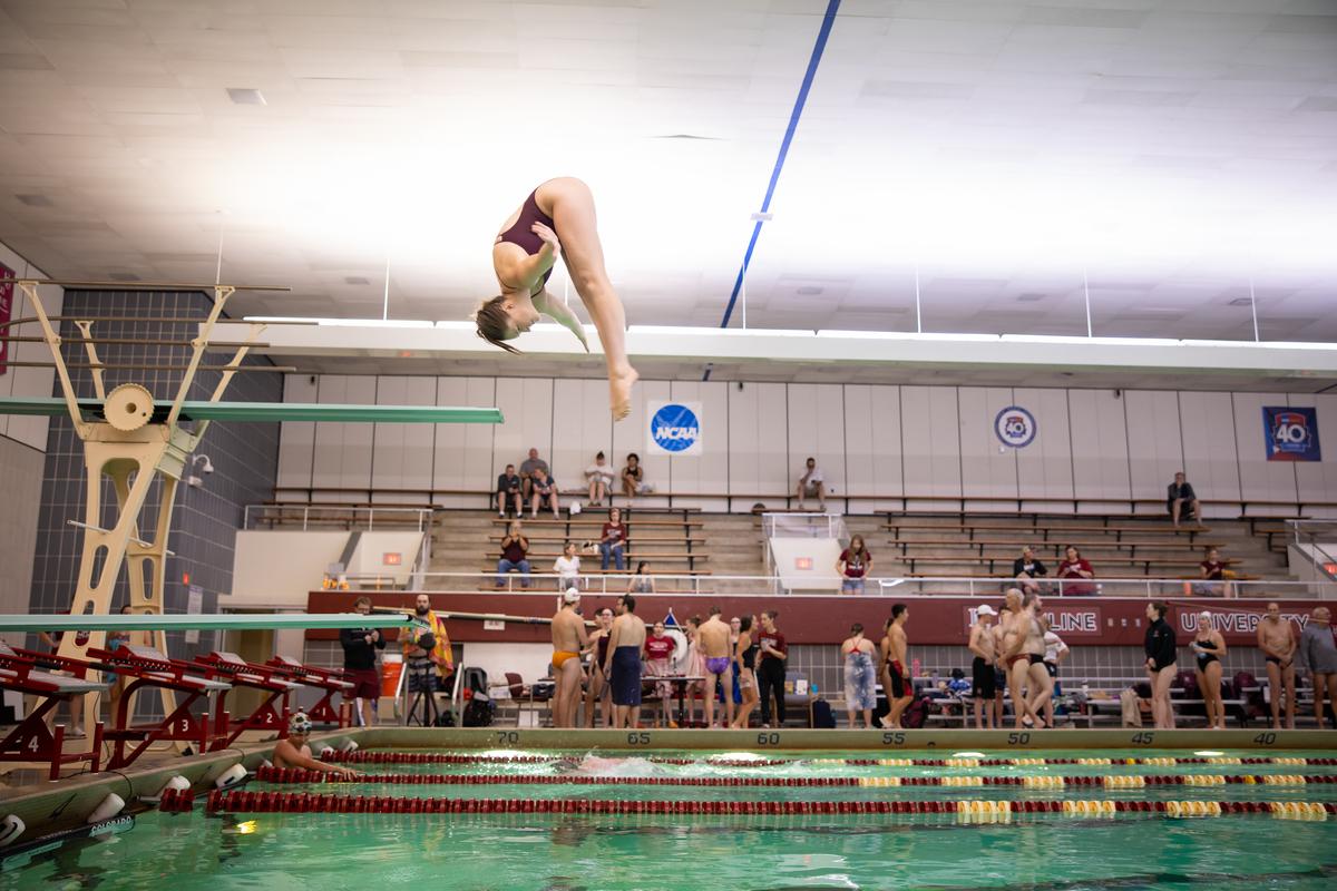 Hamline student competing at diving during Homecoming