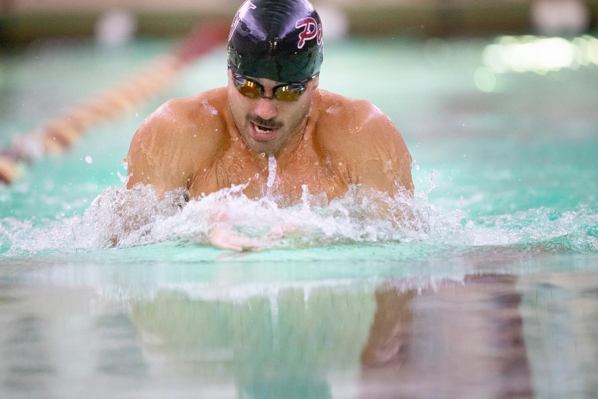Hamline swimmer competing during Homecoming