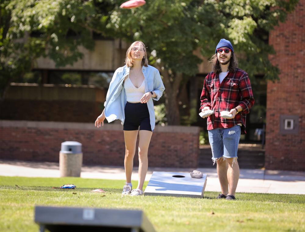 Students playing bean bag toss during Fall Welcome Week