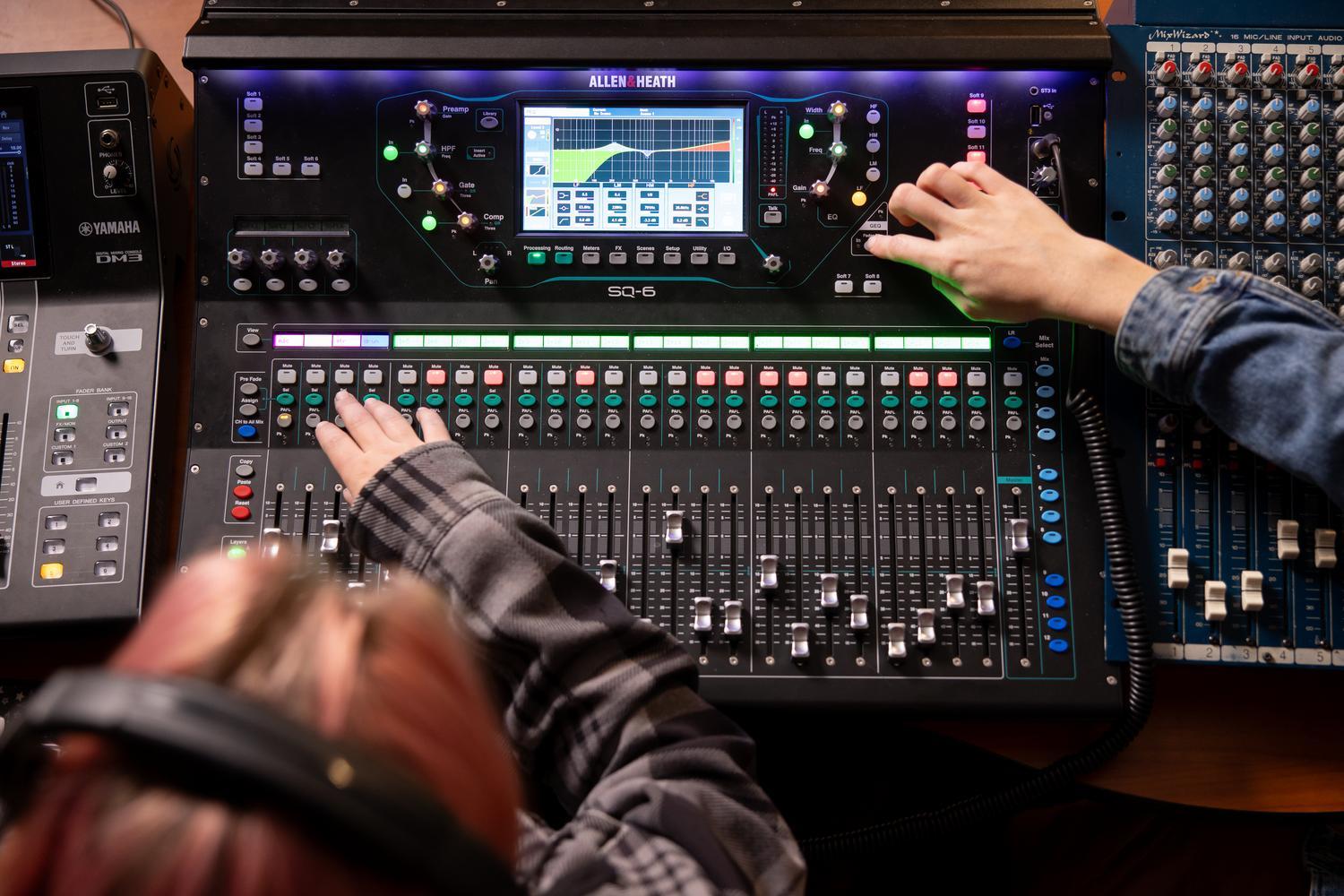 Students on the boards in the music production studio