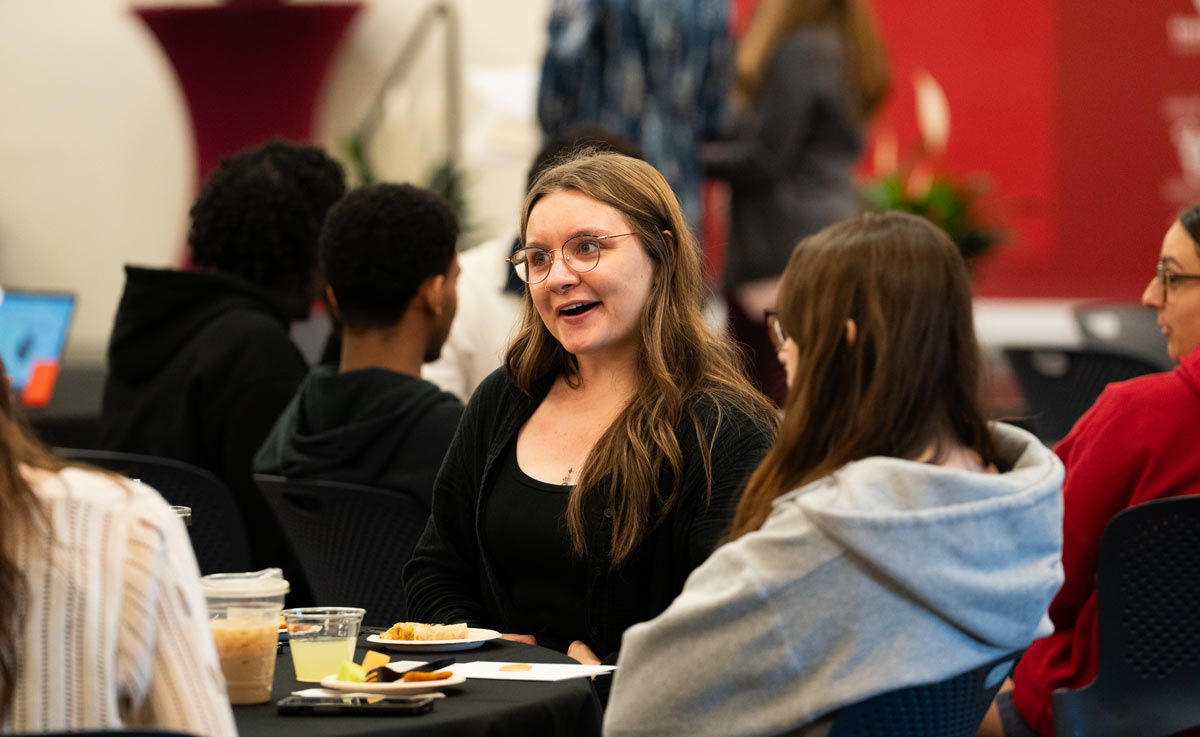 First-generation students chatting at a table