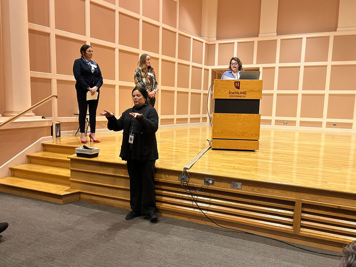 Kris Norman onstage at Women in Public Service Conference
