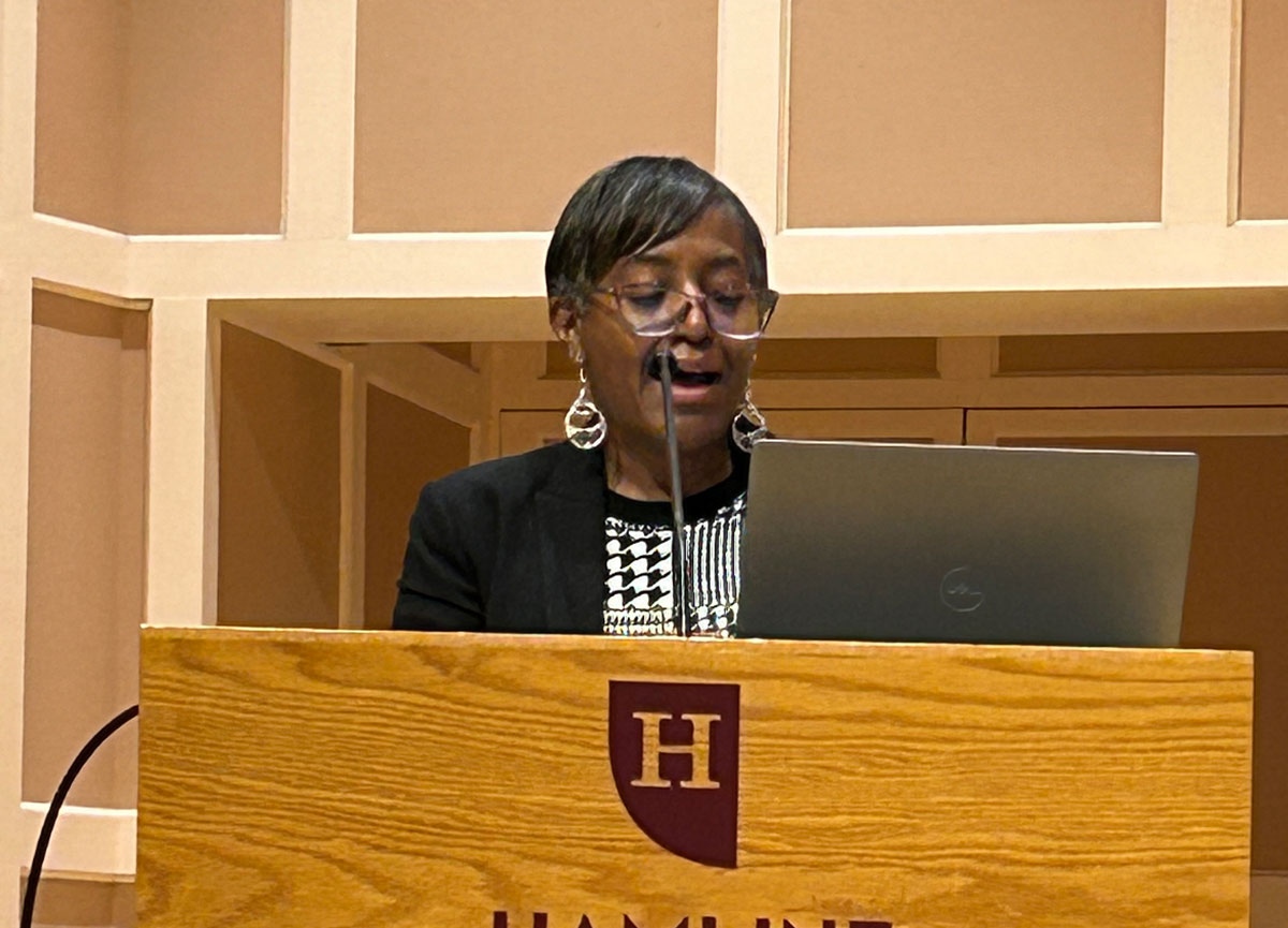 Close up of women at podium speaking at the 2025 WIPS Conference
