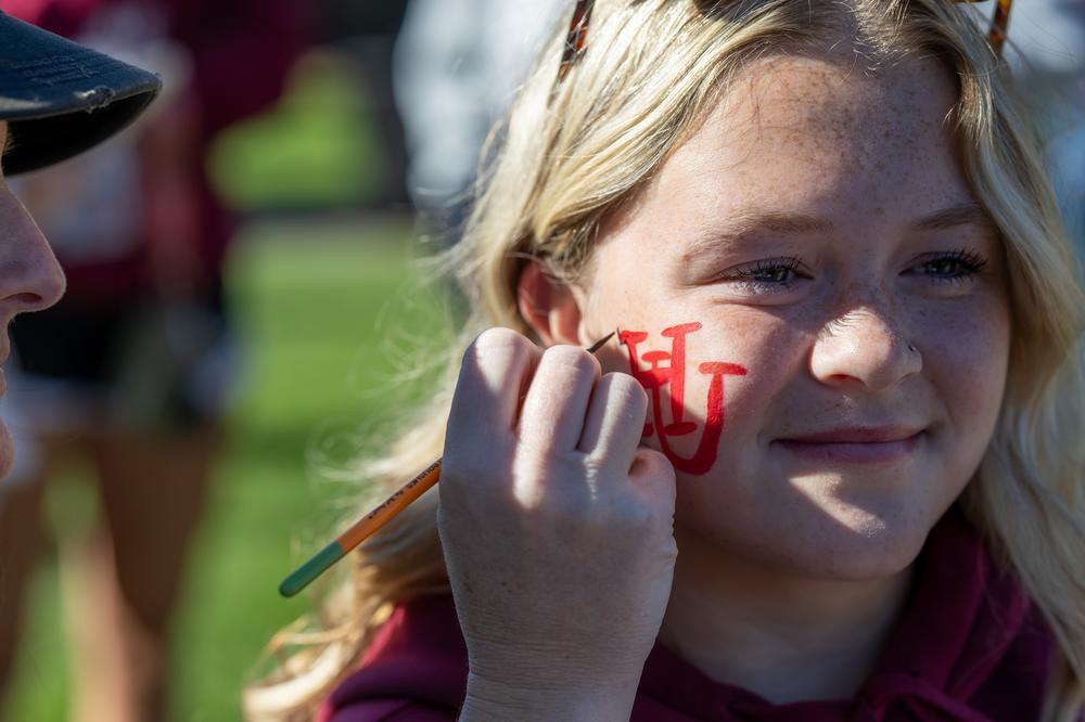Student having HU painted on her face