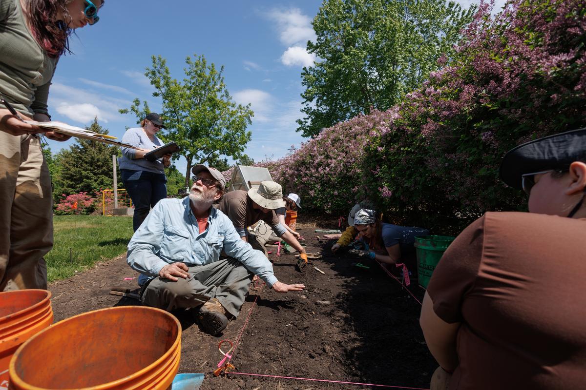 Professor Brian Hoffman with students at a dig