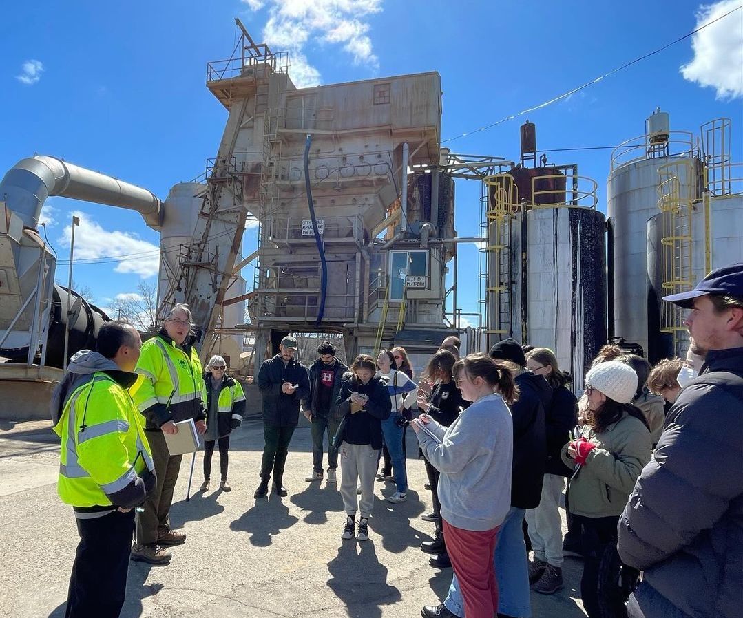 Group of students at the city asphalt plant during an Archaeology of Infrastructure class
