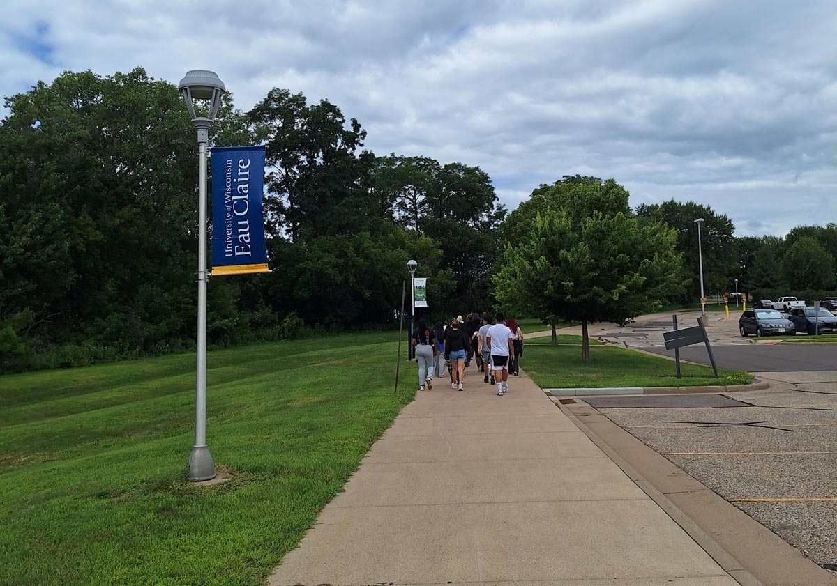TRiO students walking on a path on campus at UW-Eau Claire