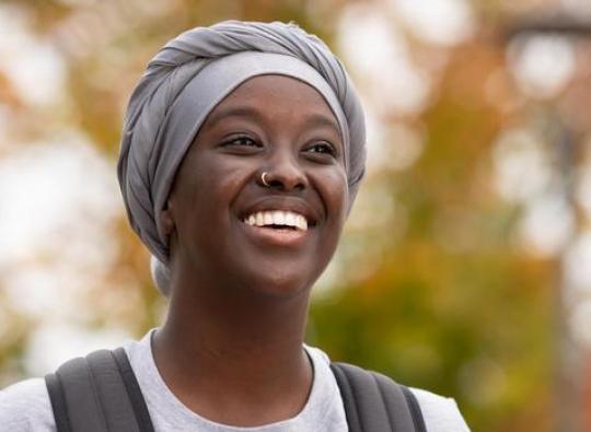 Asli Abdi a Hamline Student smilling to the picture