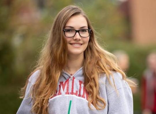 Hailey Belflower Hamline Transfer Student holding a coffee at Hamline University