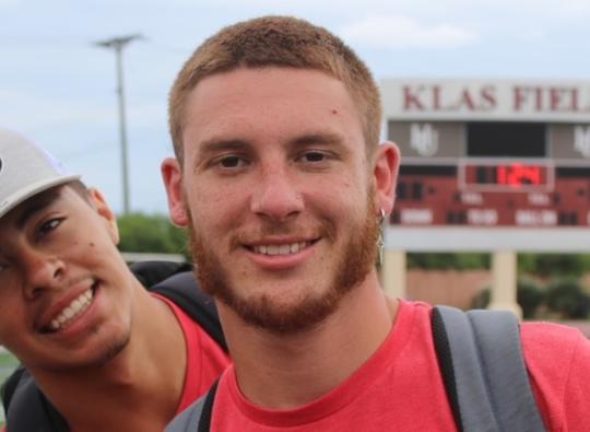 Photo of Caleb Lueders, right, at Klas Field