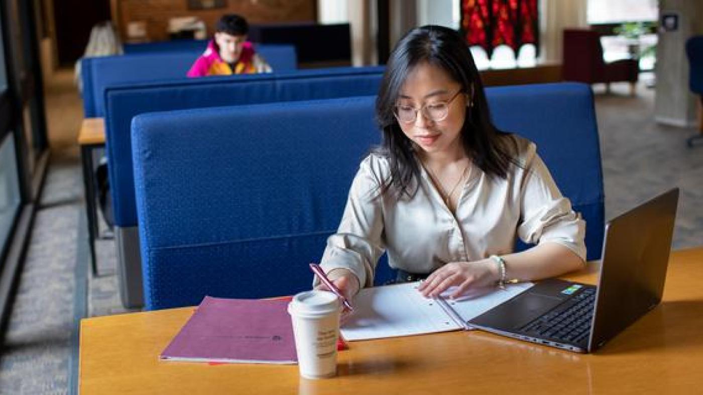 A student studies in Bush Memorial Library