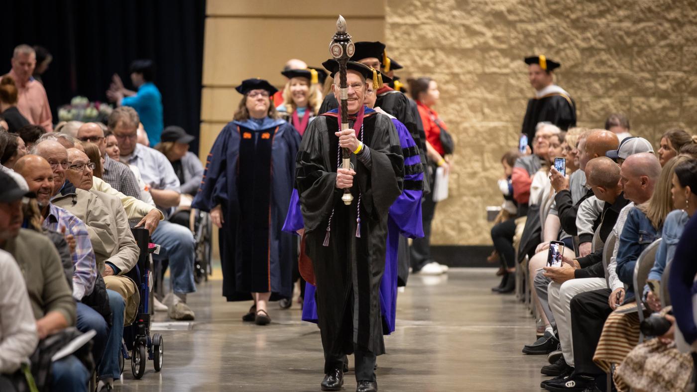 Jerry Artz leading processional for Convocation