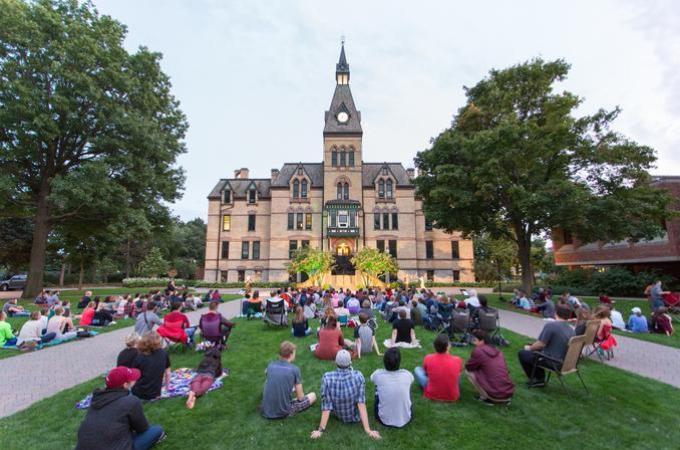 Hamline students in a ceremony in front of the Old Main