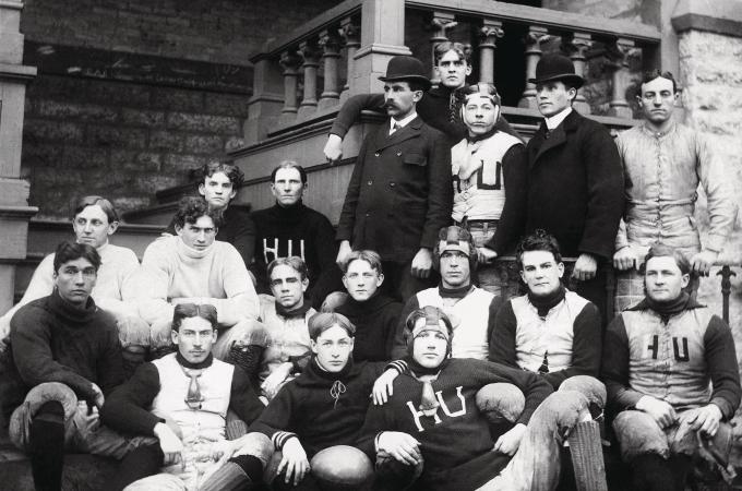 Hamline's football team outside of Old Main circa early 1900s