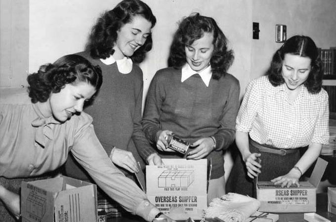 Group of students packing boxes circa 1940