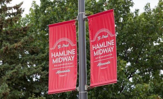 A poster on a Hamline street lamp that says "St. Paul Hamline-Midway Neighborhood, Minnesota District"