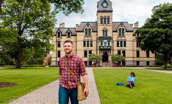 A Hamline Graduate student walking on campus