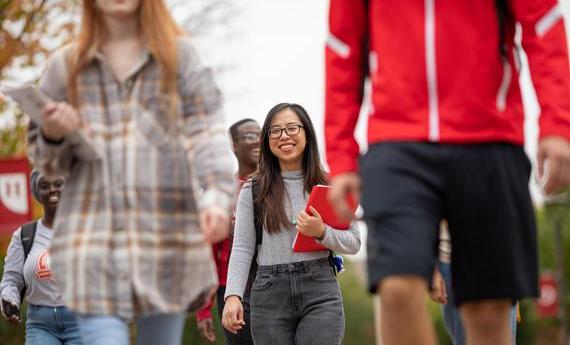 Group of Hamline international students walking on campus