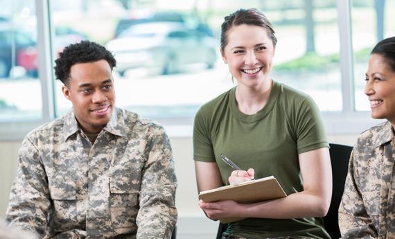 Three military students in a classroom