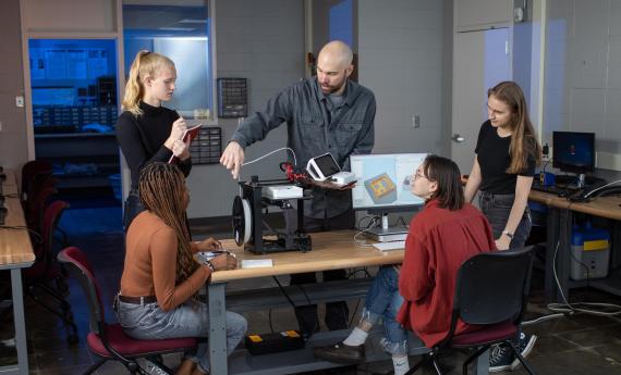 Digital Media Arts program, professor with students, 3-d printer