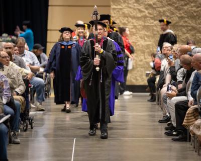 Jerry Artz leading processional for Convocation
