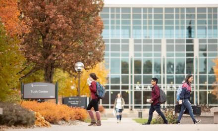 Hamline students walking in front o Klas Center building 