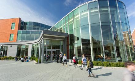 Students walking into Anderson Center at Hamline University