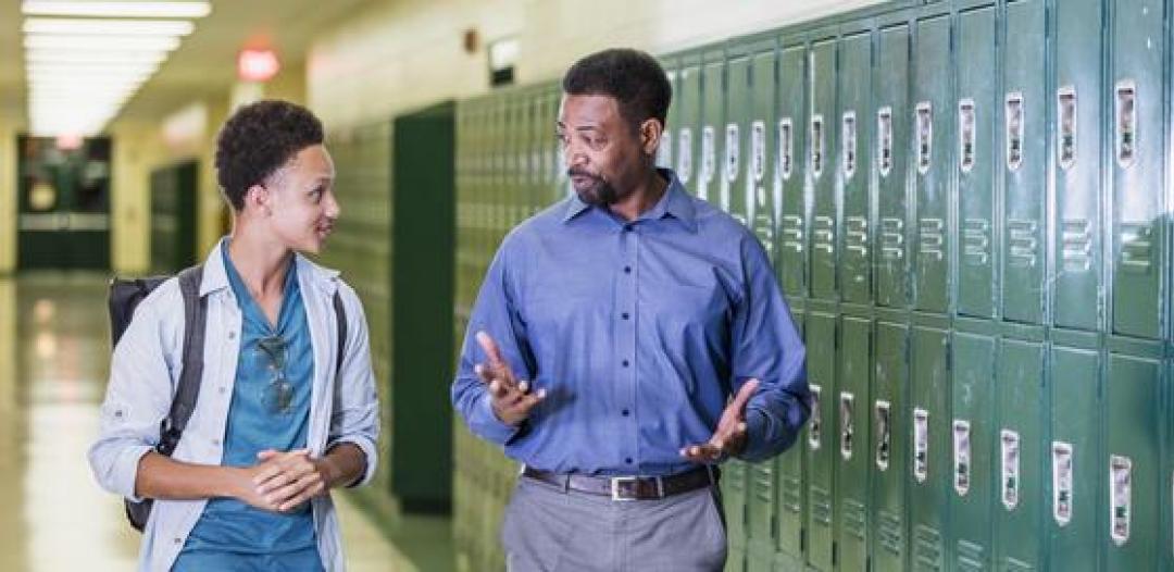 High School Counselors Professor and students talking