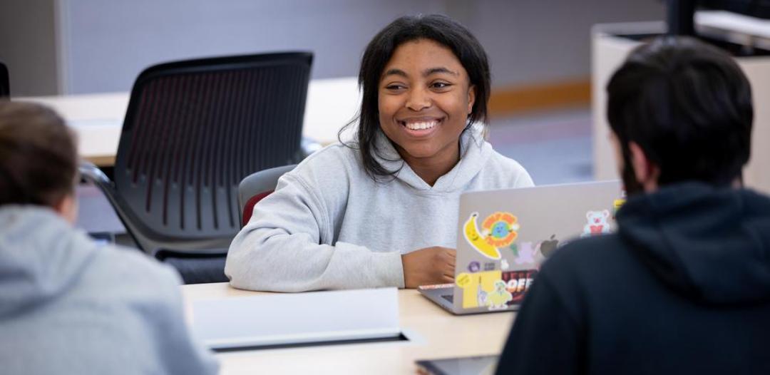 Student with laptop at table