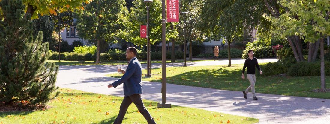 Graduate Student walking around Hamline campus