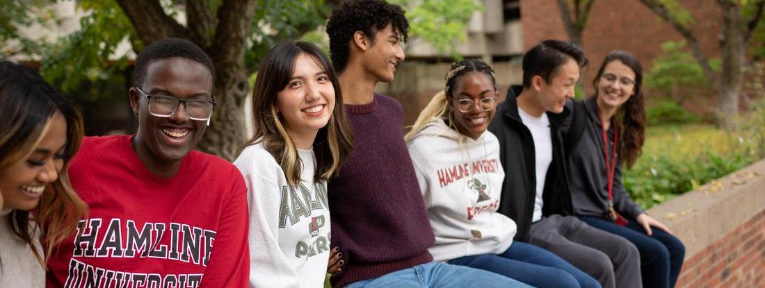 Hamline International Students at campus sittings together 