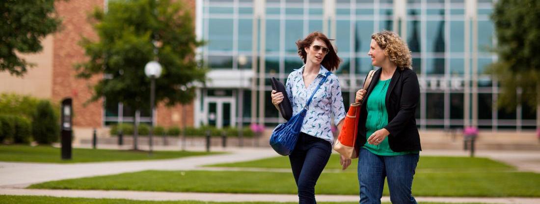 Two Hamline students talking at Hamline