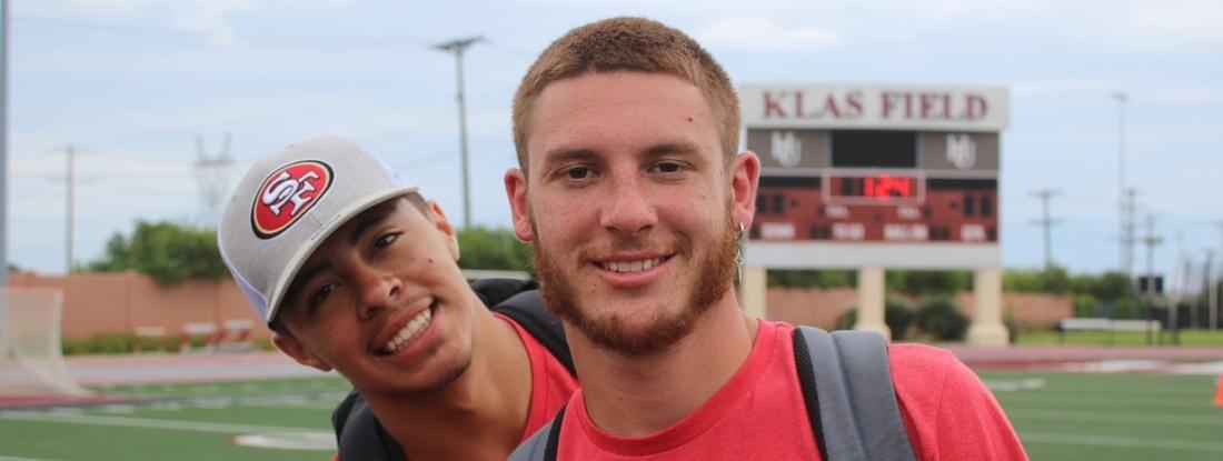 Photo of Caleb Lueders, right, at Klas Field