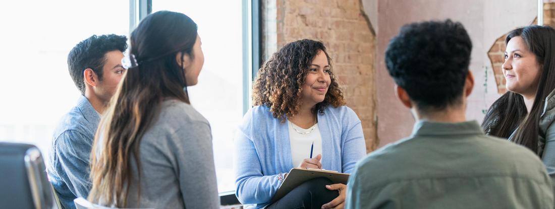 Photo of young adults participating in group therapy
