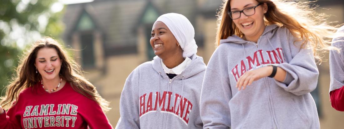 Three people in Hamline sweatshirts