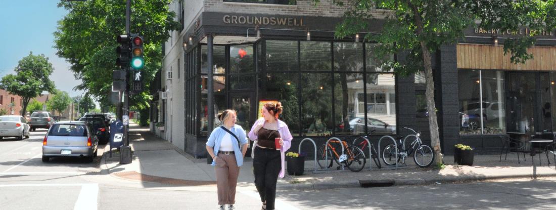 Two students walking outside Groundswell