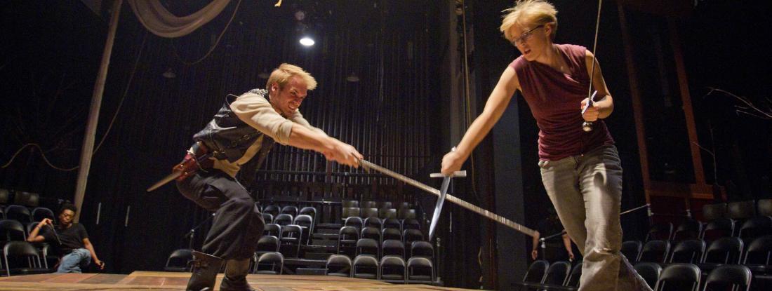 Sword fighting in Shakespeare performance for theatre and dance (Performance, Production & Community) major at Hamline 