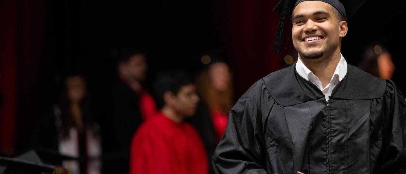 Student smiling at Commencement