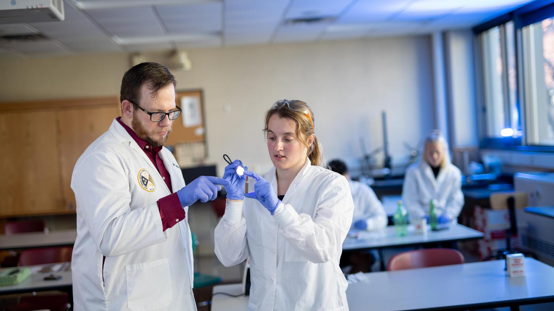 Professor Jamie Spaulding and student in forensic science major