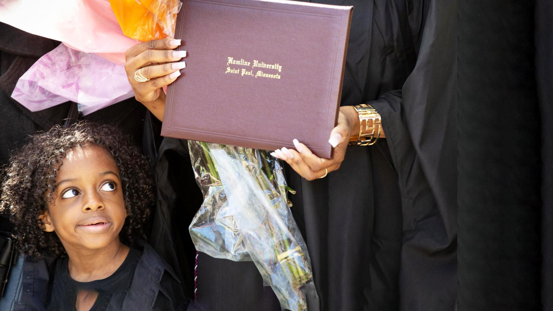 ODC student and young child at Commencement