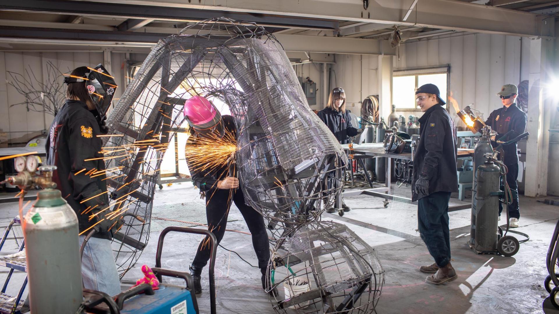 Large metal sculpture being welded