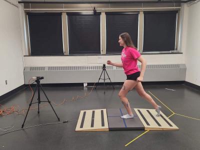 Person running on platform in the Biomechanics Lab, part of the Exercise Science program