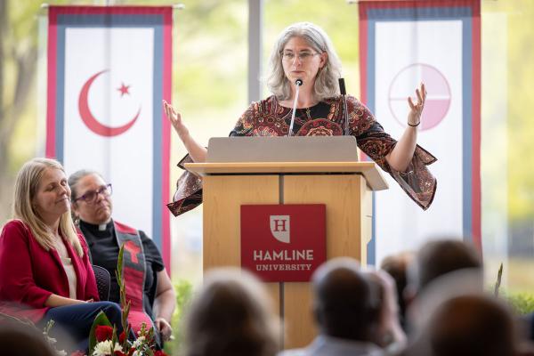 Speaker at podium during Multifaith Baccalaureate