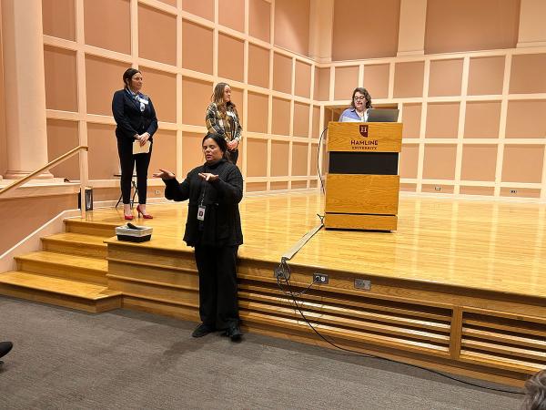 Kris Norman onstage at Women in Public Service Conference