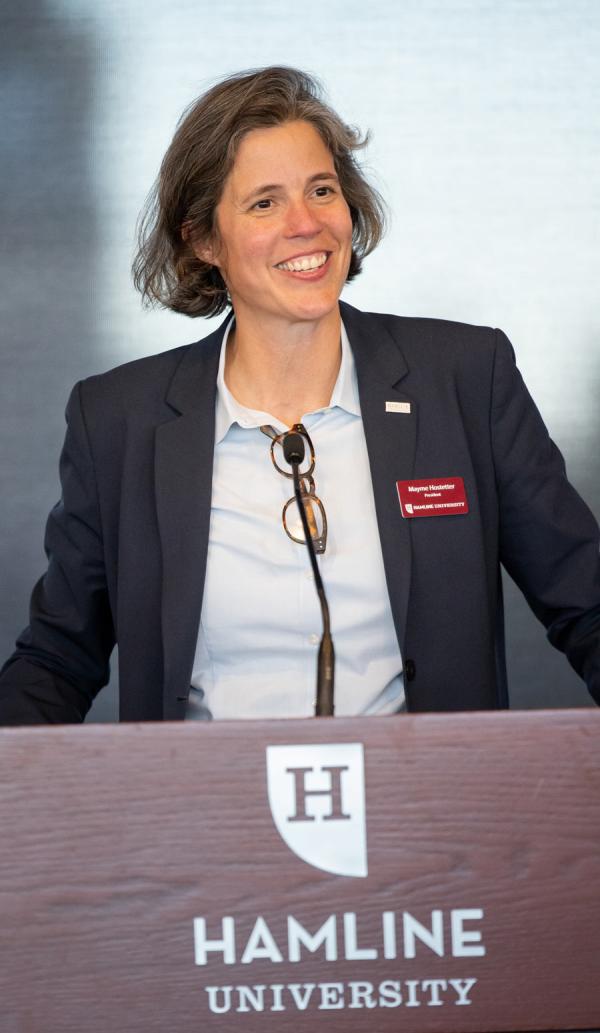 President Mayme Hostetter standing at lectern